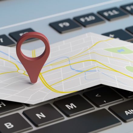 Map pointer location on a laptop. 3d illustration Online maps, gps navigation concept. Map pointer location on a computer laptop. 3d illustration